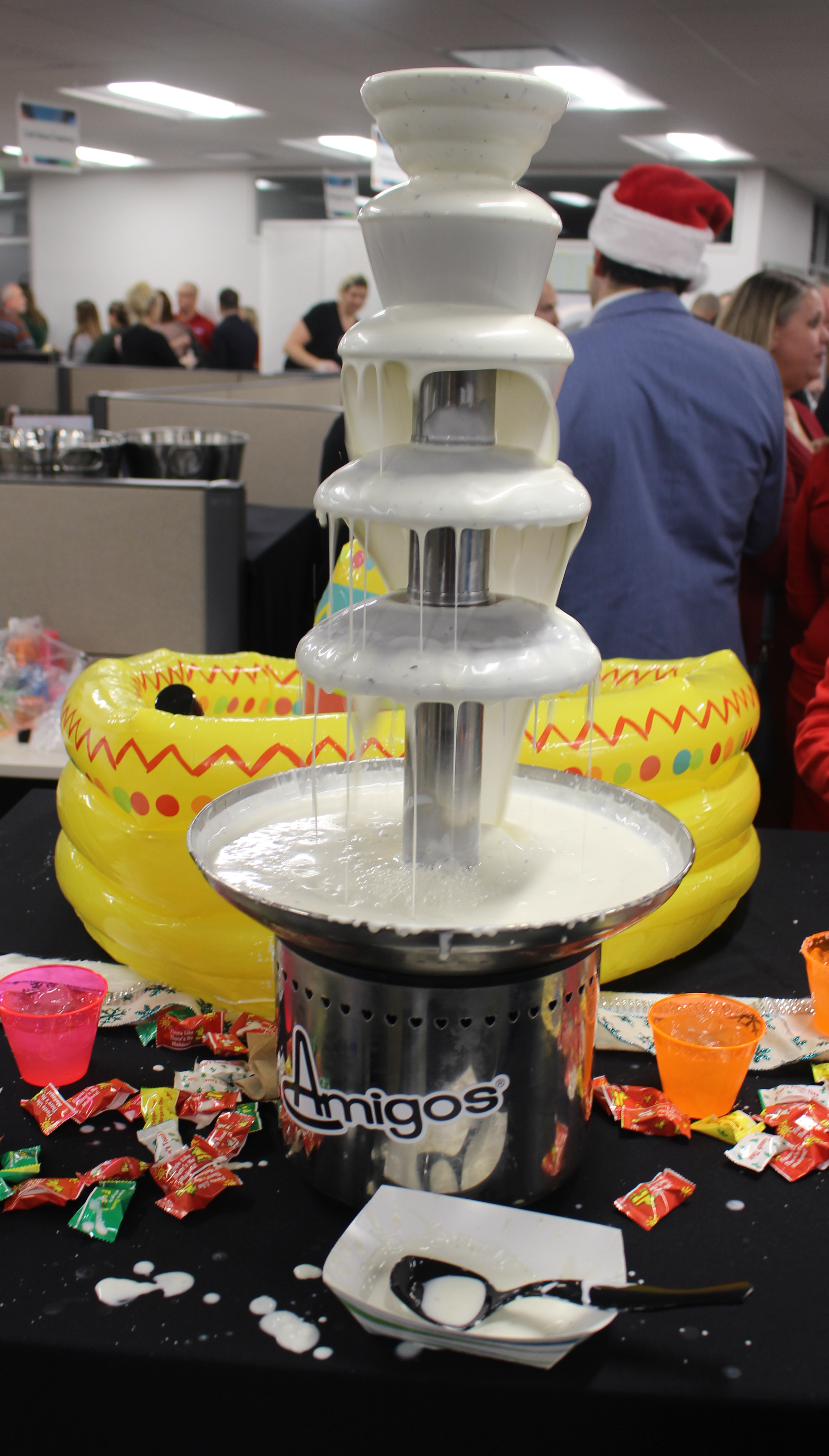 Amigos, one of the many vendors at the Member Appreciation Holiday Open House at the Greater Omaha Chamber build-ing, featured a queso fountain. (Photo by Scott Stewart)