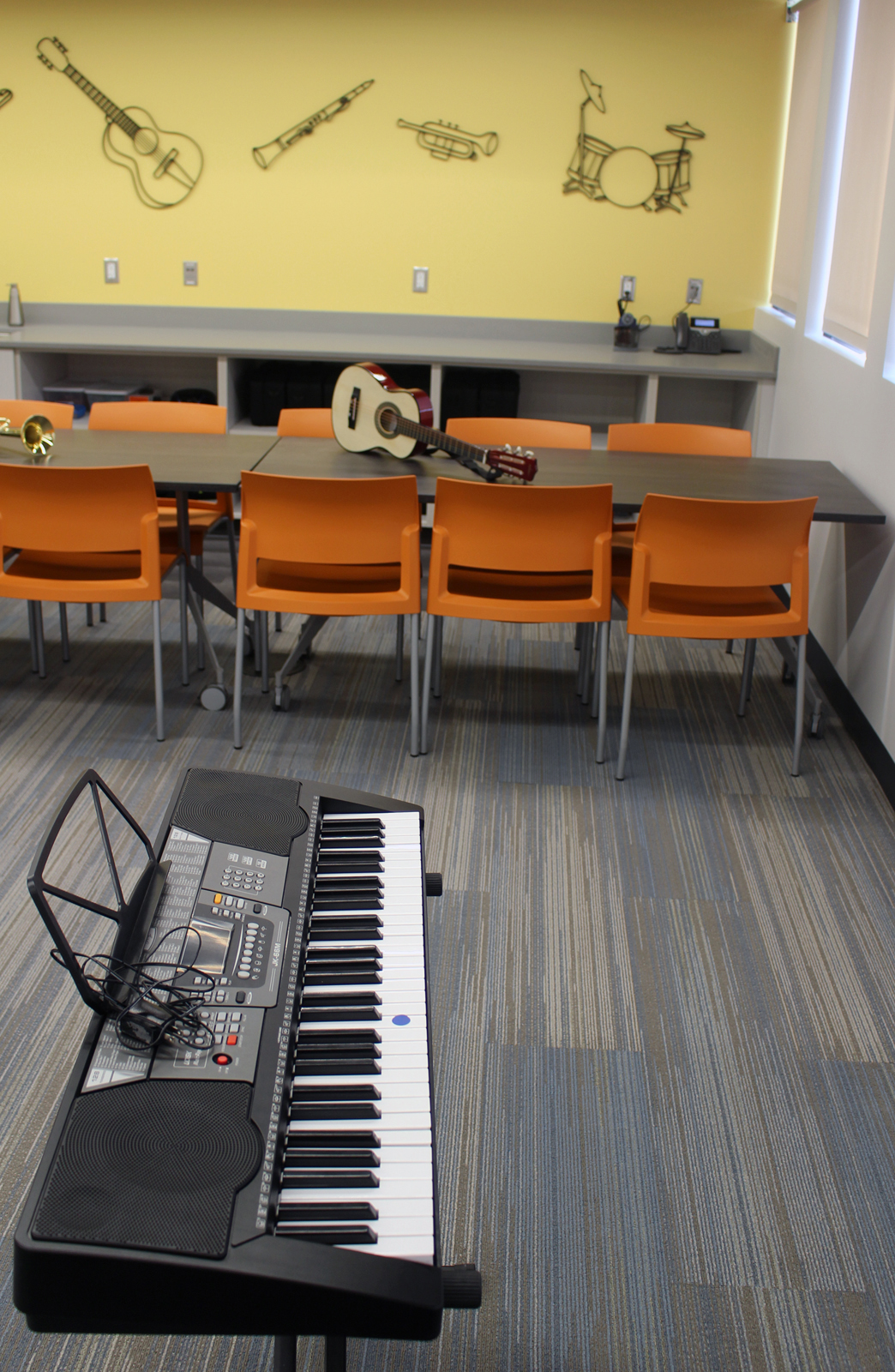 A music room in the recently renovated and expanded Completely KIDS headquarters, 2566 St. Mary’s Ave., provides a permanent home for a program that started at the suggestion of a Brownell Talbot high schooler. The class had previously met in the nonprofit’s stairwell. (Photo by Scott Stewart)