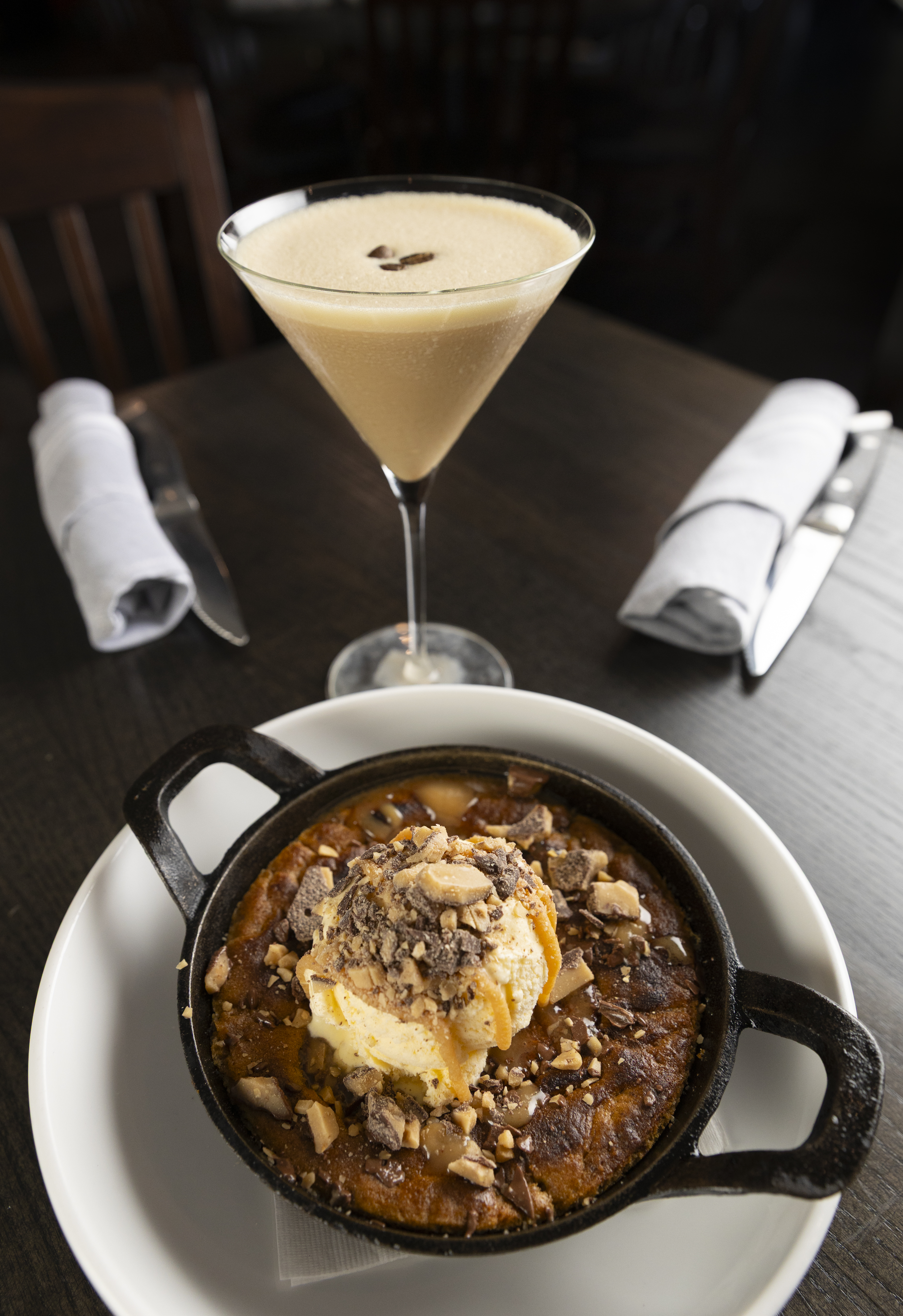 The wood-fired toffee skillet cookie with Reese&#039;s peanut butter cup, vanilla bean ice cream and brown butter caramel. It’s paired here with an espresso martini. Flatwater food critic Sarah Baker Hansen says the skillet cookie is “sweet, crunchy, warm and, honestly, very difficult to stop eating.”<br />(Ryan Soderlin / Flatwater Free Press)
