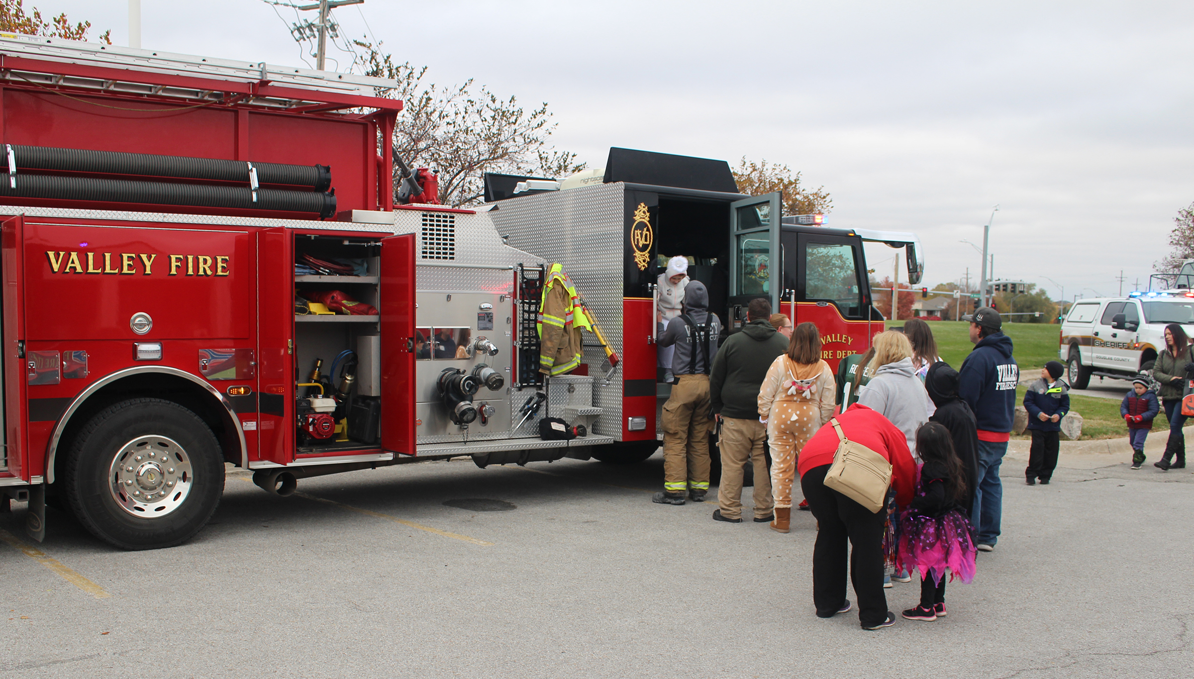 Families line up to trick-or-treat at a Valley Fire Department engine on Saturday, Oct. 27, 2019. (Photo by Scott Stewart)