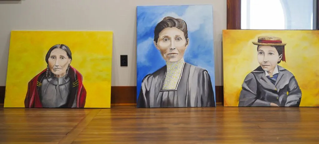 Two painted portraits of Dr. Susan La Flesche Picotte (center and right) along with one of her mother, Mary One Woman (left) which will be hung at the new center in Walthill. Dr. Susan La Flesche Picotte was America’s first Native American doctor. The center bearing her name will again medically treat tribal members and others in the community.<br />(Jerry L Mennenga / Flatwater Free Press)