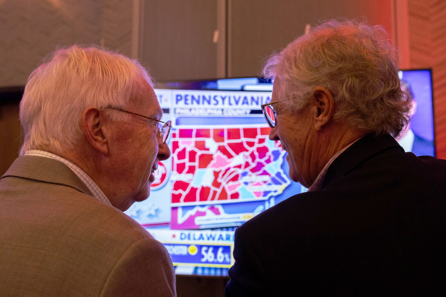 State Sen. Merv Riepe of Ralston and Fletcher Reel of Omaha discuss election results for Pennsylvania at the Nebraska GOP watch party in Bellevue on Nov. 5, 2024.<br />(Marissa Lindemann / Nebraska News Service)