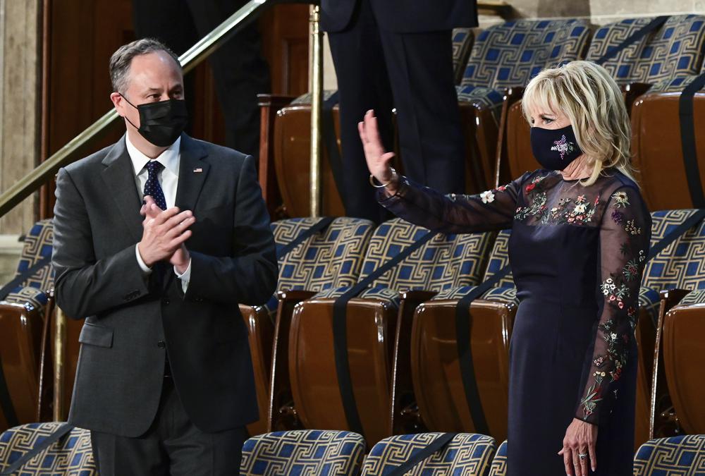 Doug Emhoff, husband of Vice President Kamala Harris, applauds as first lady Jill Biden waves as President Joe Biden addresses a joint session of Congress, Wednesday, April 28, 2021, in the House Chamber at the U.S. Capitol in Washington. (Melina Mara/Pool via AP)