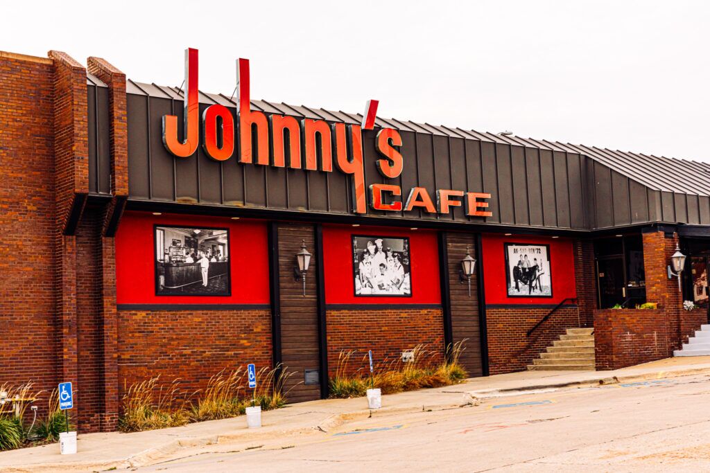 Johnny’s Cafe, Omaha’s oldest restaurant, got a spruce-up last year when a government grant for historic restaurants allowed the Kawa family to do exterior improvements, including new signs and photos in front of the restaurant.<br />(Joshua Foo / Flatwater Free Press)