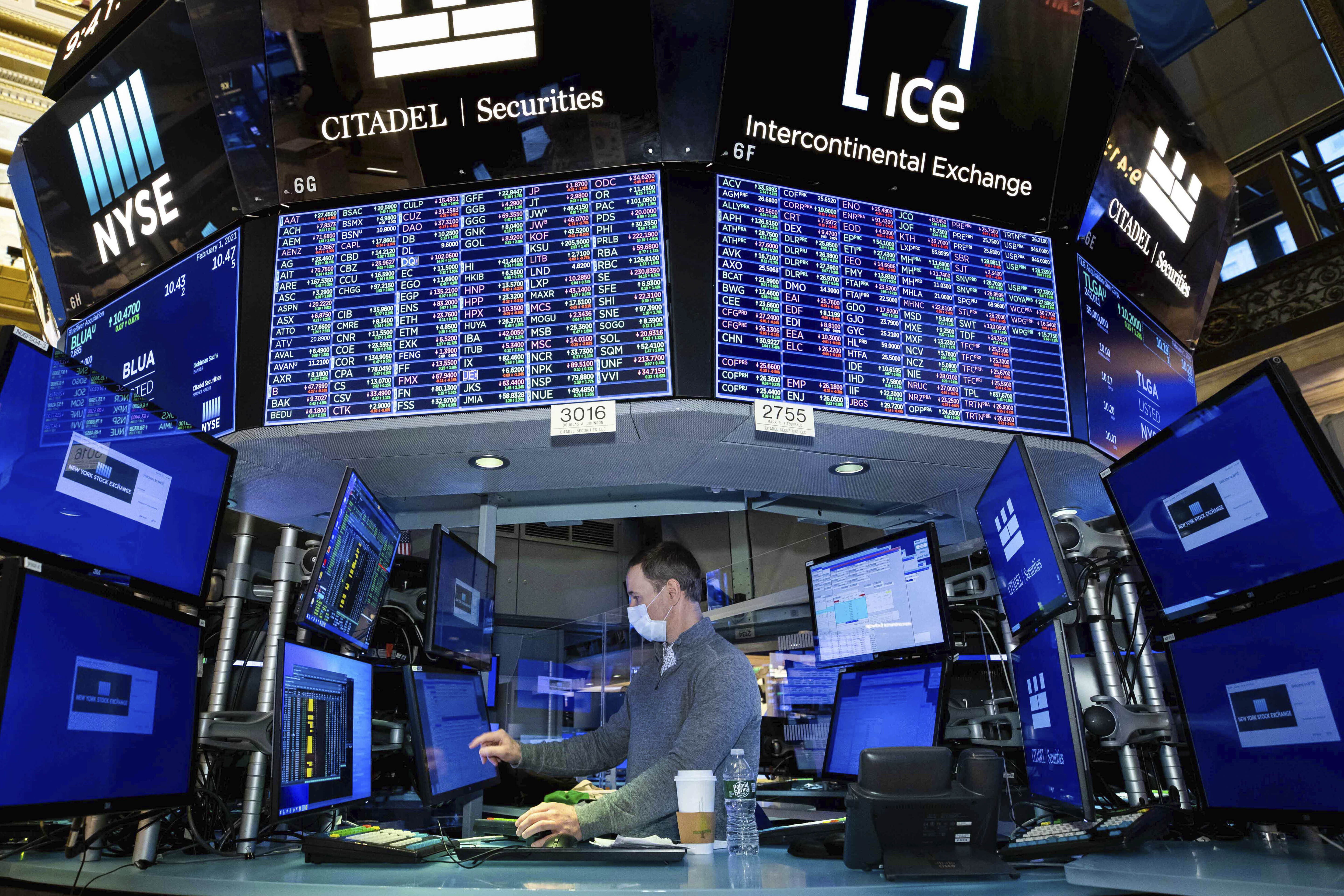Stephen Naughton works at a post on the trading floor, Monday, Feb. 1, 2021. The erratic trading in shares of underdog companies like GameStop that turned markets combustible last week appears to have migrated to commodities, too. (Nicole Pereira/New York Stock Exchange via AP)