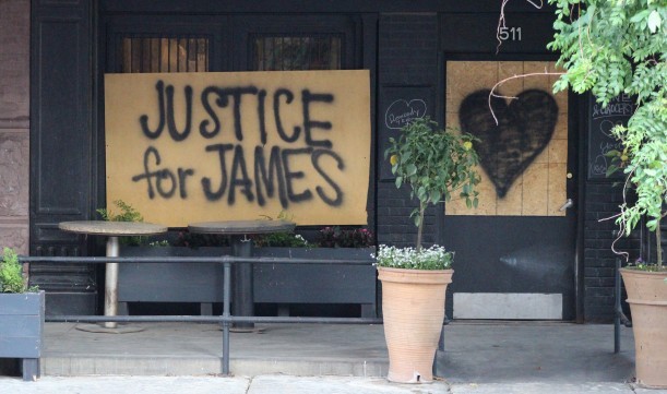 Boarded up windows at La Buvette Omaha in the Old Market calls for “Justice for James” and support for the Black Lives Matter movement on Tuesday, June 2, 2020. (Scott Stewart/Daily Record)