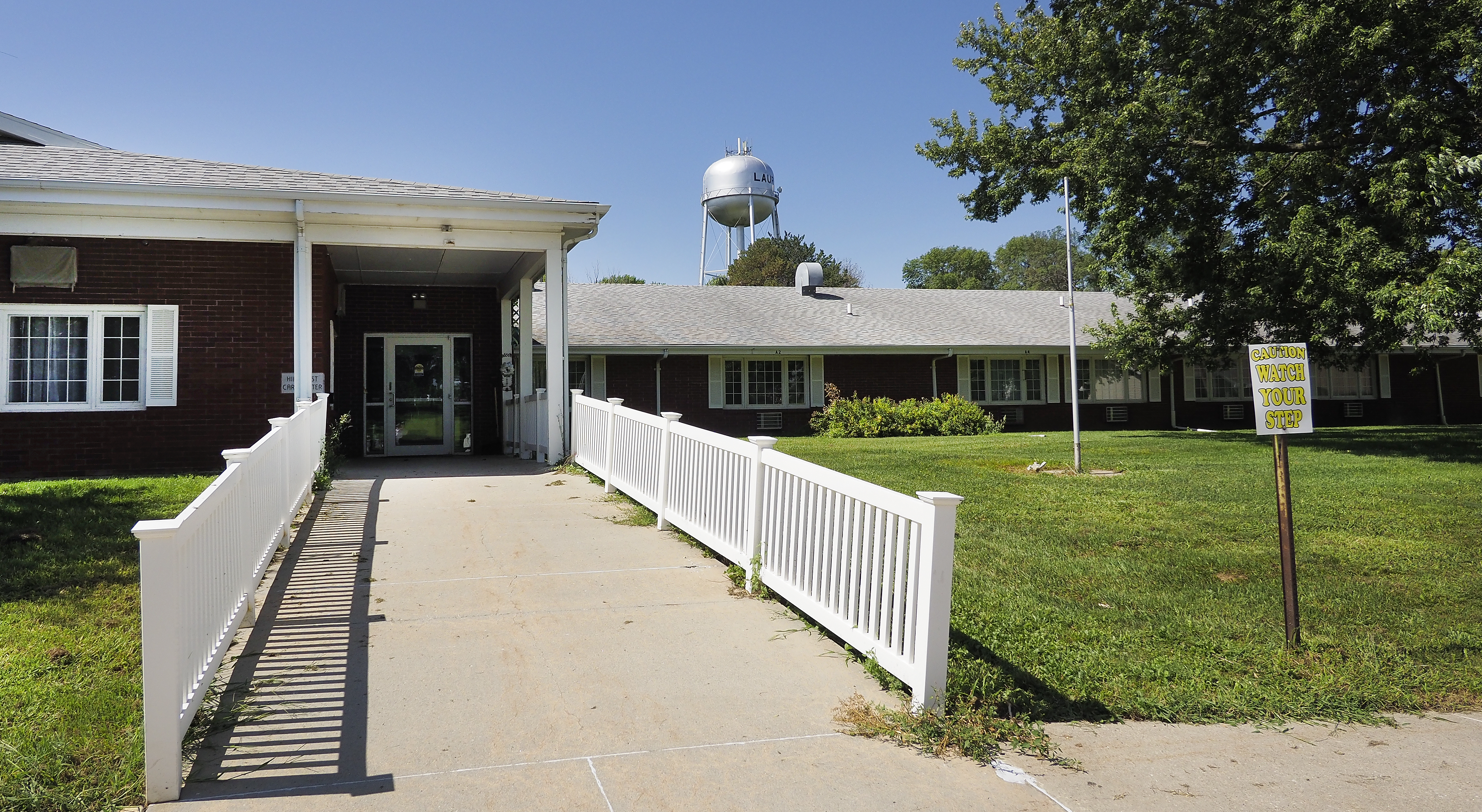 The Laurel water tower can be seen behind the shuttered Hillcrest Care Center and Assisted Living campus in Laurel. Former employees largely blame the closure of the city-owned center on its former administrator.<br />(Jerry L Mennenga / Flatwater Free Press)