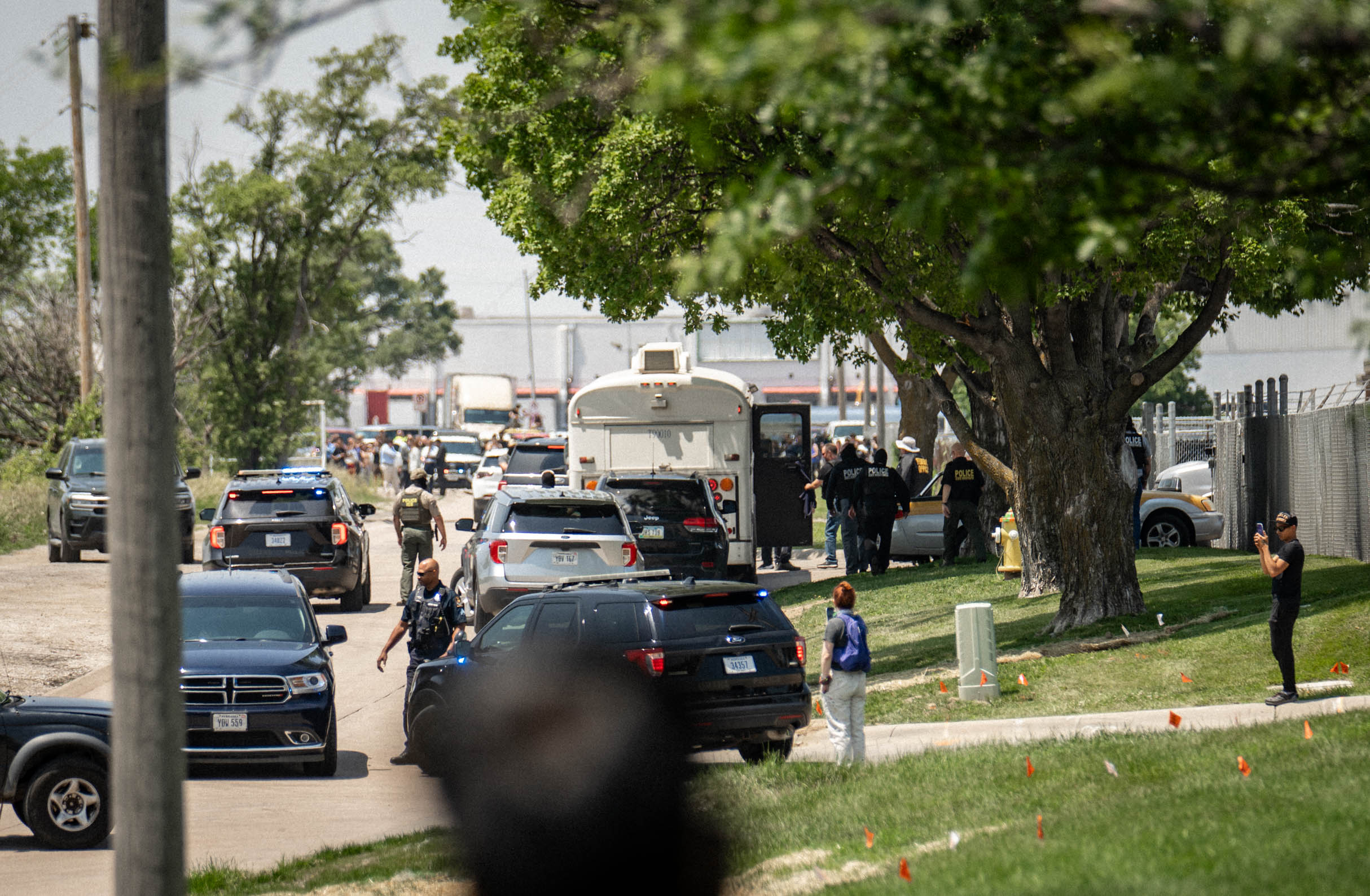 Law enforcement officers and protesters gather outside the Glenn Valley Foods plant in south Omaha, Nebraska, on June 10, 2025. Neither the Omaha Police Department nor the Douglas County Sheriff&#039;s Office has a 287(g) agreement with Immigration and Customs Enforcement. However, the Nebraska State Patrol does.<br />(Abiola Kosoko / Flatwater Free Press / Use of this photo for purposes other than this story is prohibited.)