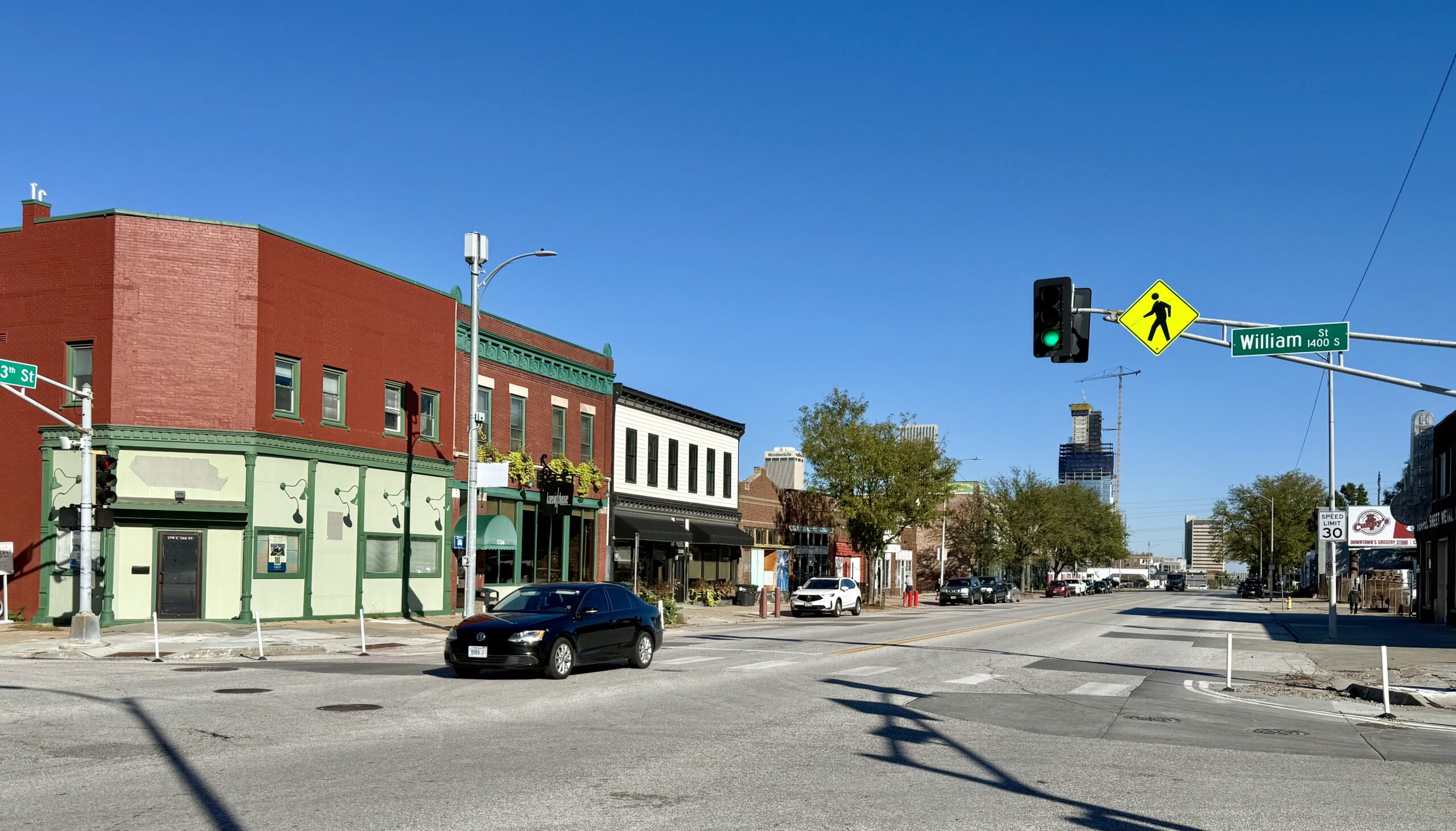 View today from 13th and William Streets, looking north to downtown Omaha. At the forefront is an 1890 structure once occupied by the Golden Goose and later a postal union hall, among other tenants. It would be rehabbed with help of historic tax credits.<br />(Cindy Gonzalez / Nebraska Examiner)