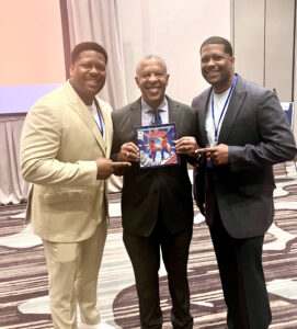 Mayor-elect John Ewing with Anthony and Anton Downing at the Reignite2Unite developer symposium, at which all three spoke.<br />(Courtesy of Erin Grace)