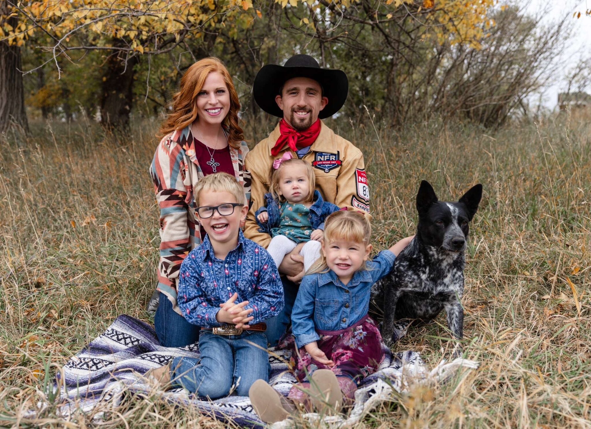 Katie and Garrett Shadbolt with children (from left) George, Lindin and Mavis and dog Lana. The family from Merriman frequently travels to watch Garrett compete in rodeos across the country, often riding in a camper that acts as their home away from home.<br />(Courtesy photo)