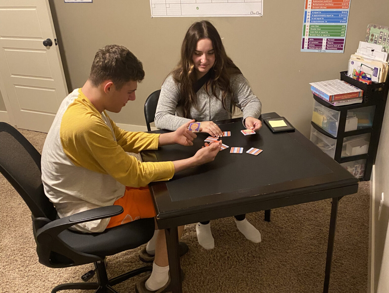Max Perry of Lincoln, challenged by autism spectrum disorder and epilepsy, plays a memory game as part of applied behavior analysis therapy. His mom, Nikki Perry, says the game helps with social interaction, rules, coping with loss, celebrating wins and more. Nebraska officials have cut Medicaid reimbursement rates to providers as costs soar, saying they want to be more aligned with other states.<br />(Courtesy of Perry family)