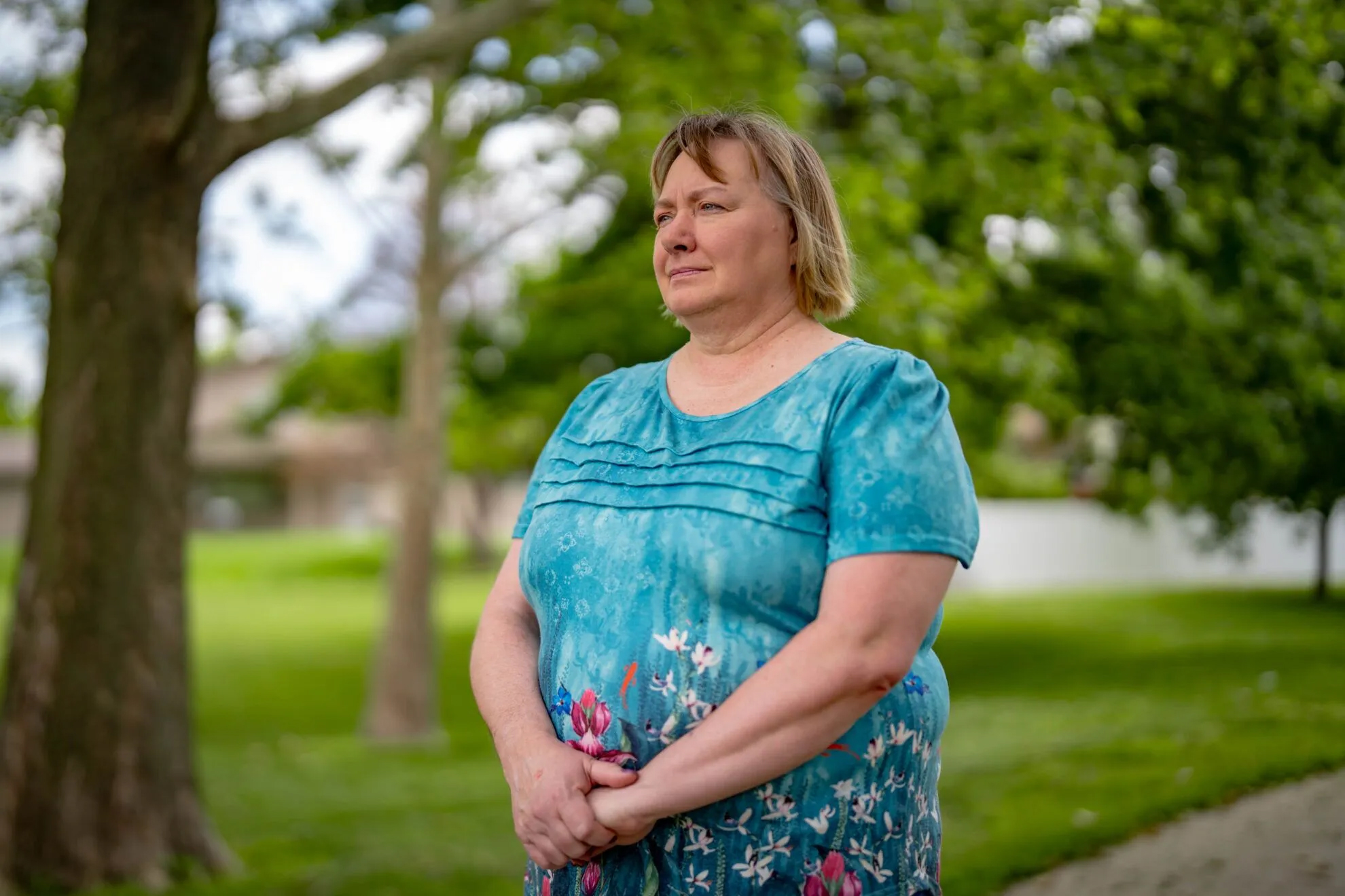 Jacque Palczynski, the mother of a son who struggles with a serious mental illness, poses for a photo June 6. Palczynski has tried several times to commit her son and force him to receive treatment for his schizoaffective disorder. But the safety net in Douglas County has not helped, she said, which has led her son to cycling in and out of hospitals and jail.<br />(Abiola Kosoko / Flatwater Free Press)