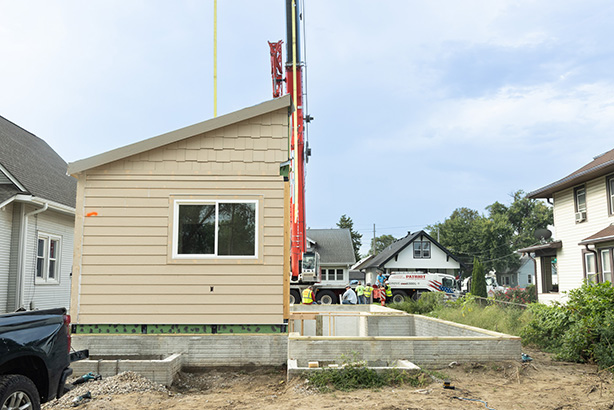 A for-sale house built by students at Metropolitan Community College’s Fort Omaha campus was transported in pieces Friday to its final destination in the Miller Park neighborhood of North Omaha.<br />(Courtesy of Metropolitan Community College)