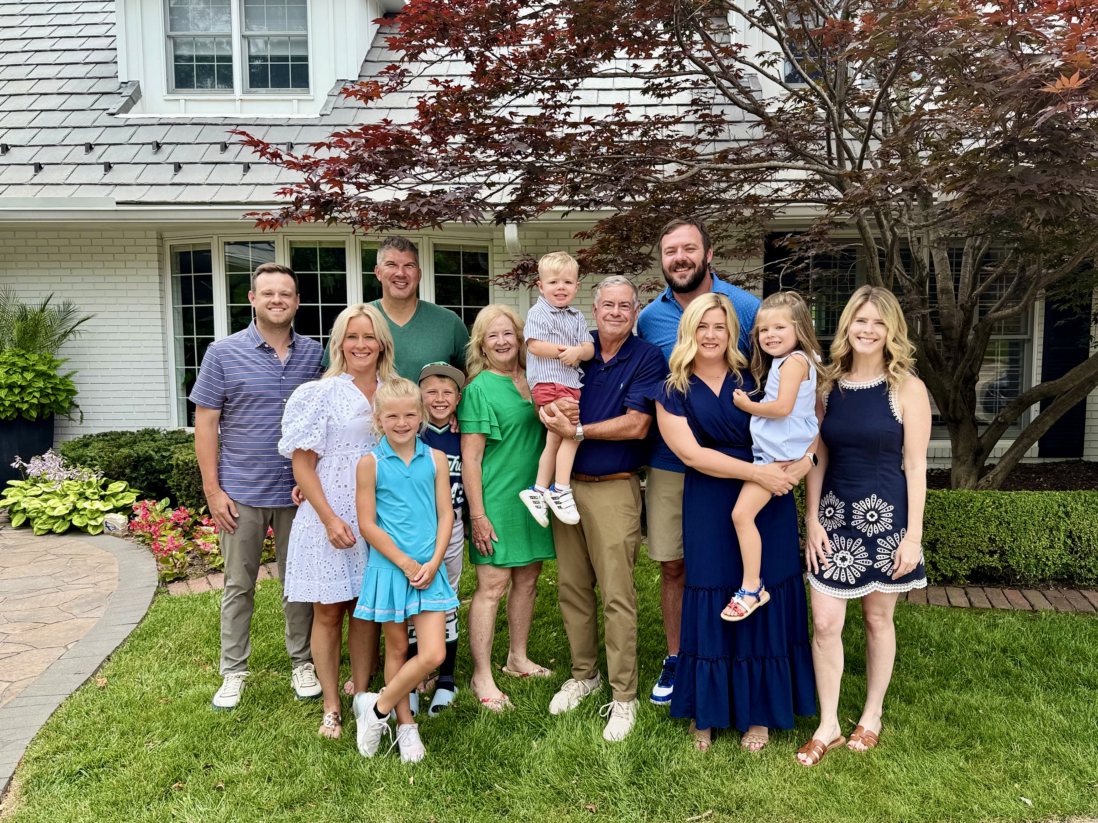 Although Attorney Michael Mullin (center) has received numerous honors and recognitions throughout his legal career, he said he is most proud of his family, which includes wife, Joani, just celebrating their 42nd anniversary, four children and four grandchildren.<br />(Courtesy Photo)