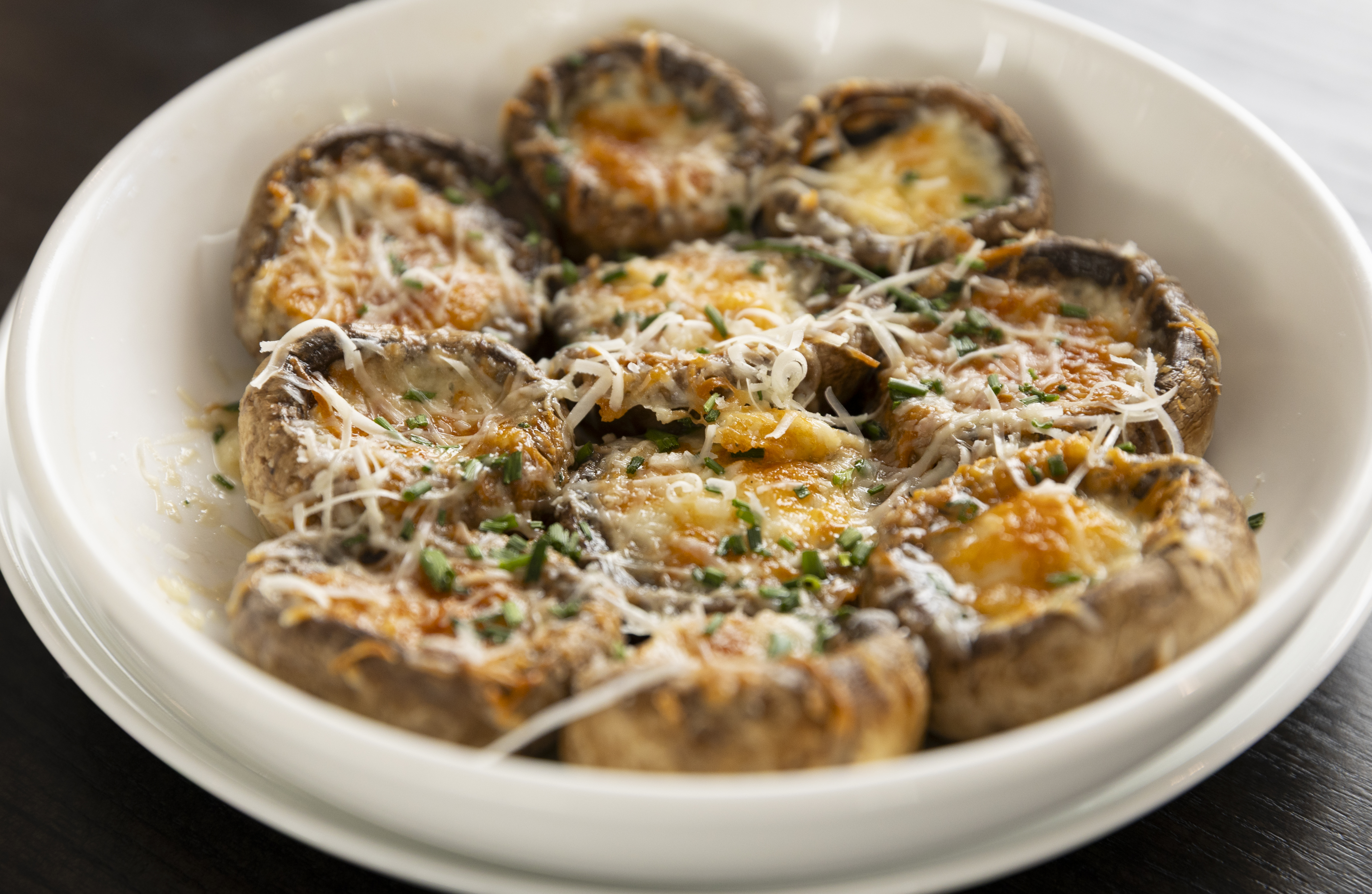 The stuffed mushrooms, known at Ruhlman’s as the “million-dollar mushrooms.” They’re roasted until tender, stuffed with a mix of four cheeses and then sprinkled with chives.<br />(Ryan Soderlin / Flatwater Free Press)