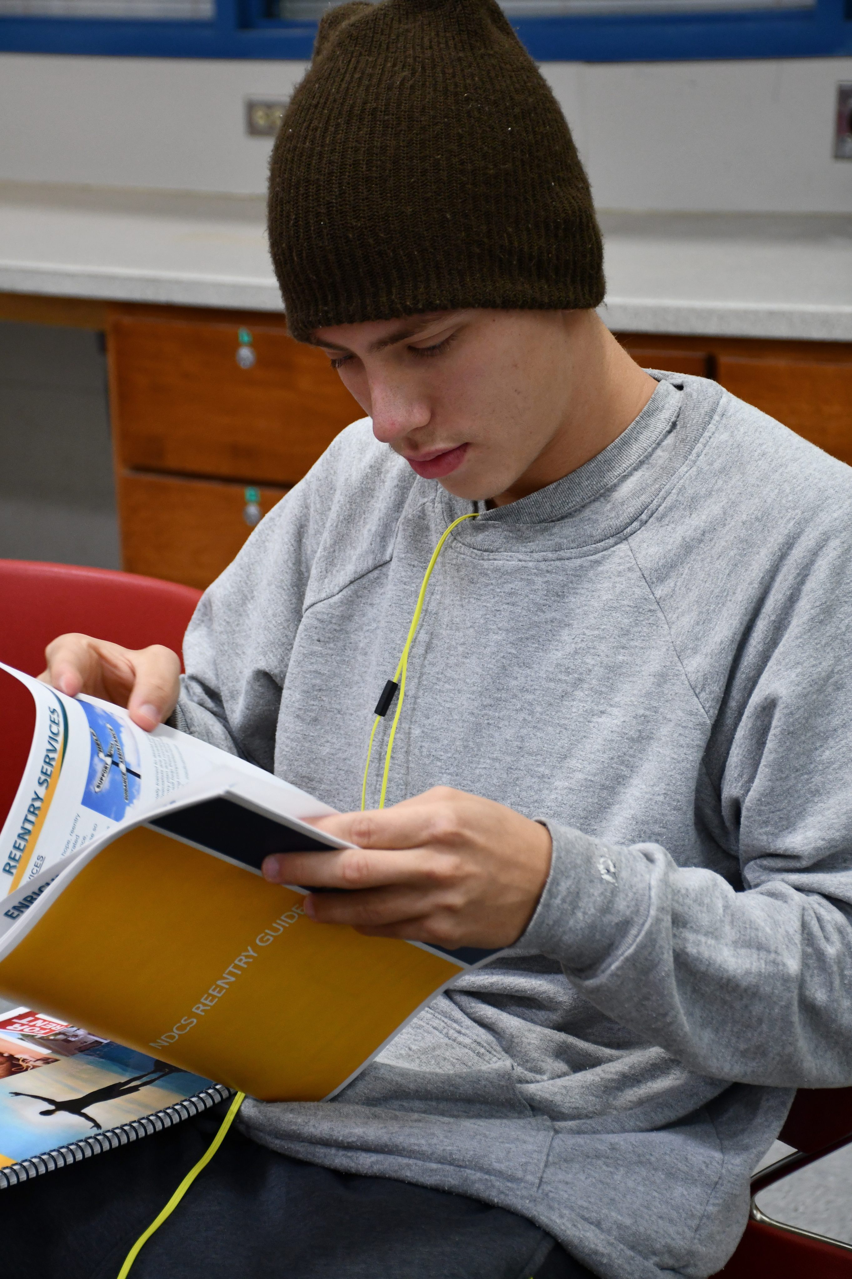 Daniel Virgil reads a workbook at Community Corrections Center-Lincoln. “When I got to the Work Ethic Camp, I already had a game plan of what I wanted to do while I was there, because the Reentry Workbook told me what I could expect,” Virgil said. (Courtesy NDCS)