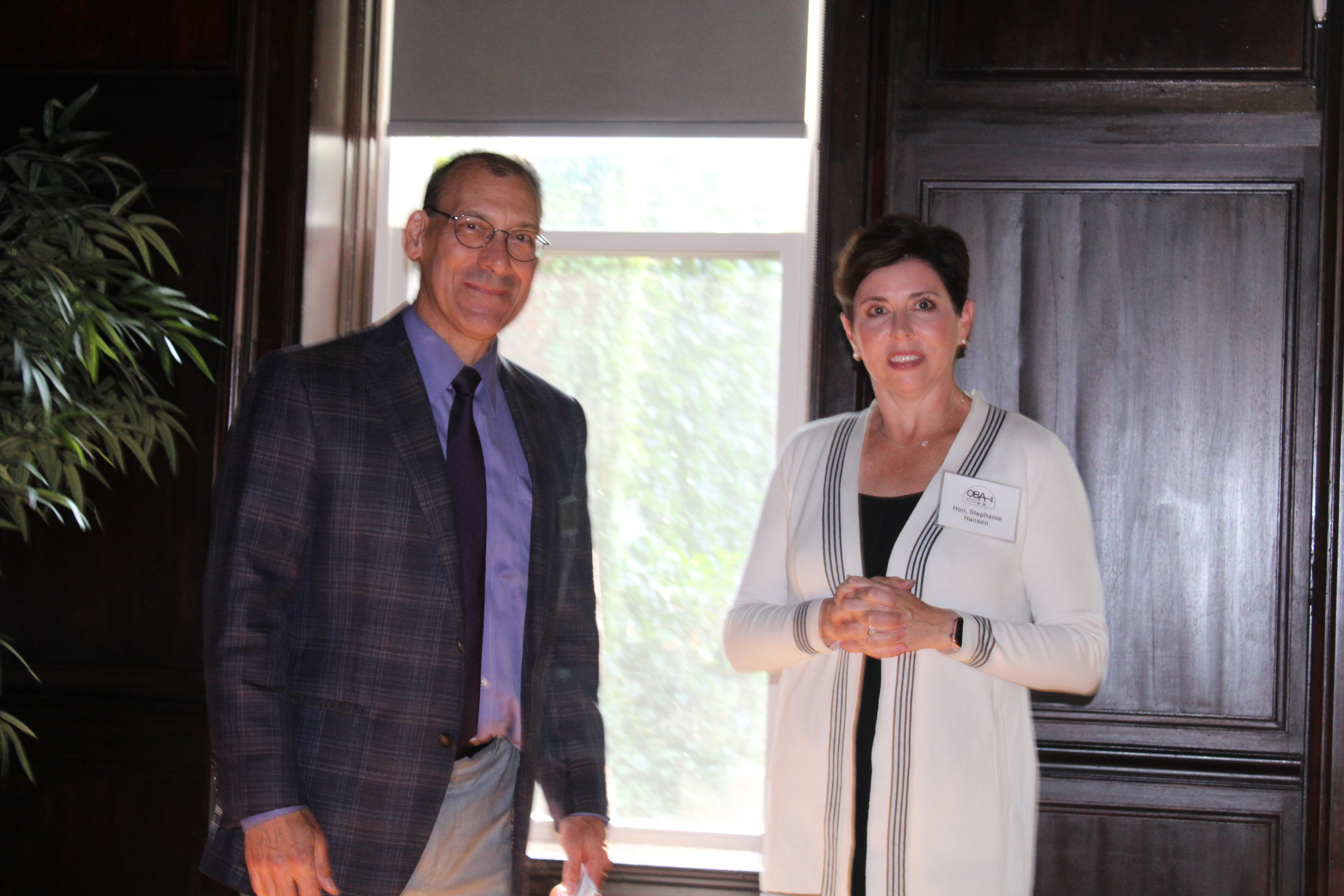 Outgoing OBA President Dave Koukol shares some words of wisdom with new president, Judge Stephanie Hansen, July 21, 2021. (David Golbitz/Daily Record)