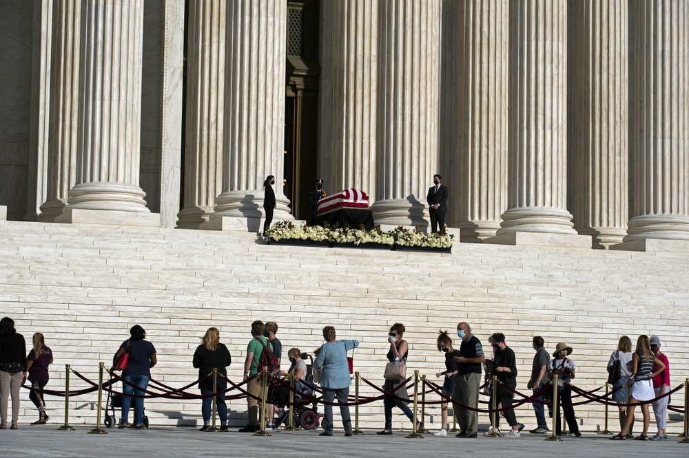 Mourners pay their respects as Justice Ruth Bader Ginsburg lies in repose under the Portico at the top of the front steps of the U.S. Supreme Court building on Wednesday, Sept. 23, 2020, in Washington. Ginsburg, 87, died of cancer on Sept. 18. (AP)