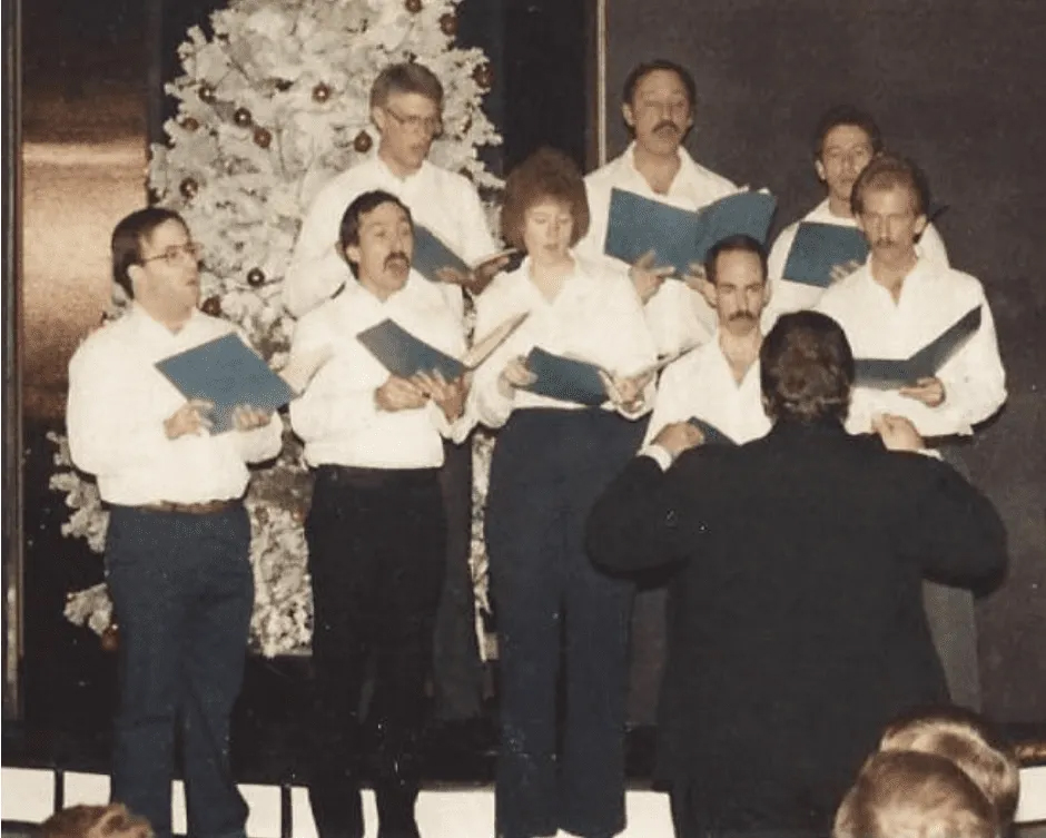 The River City Mixed Chorus performing its first concert at The Max on Dec. 16, 1984. The initial members were (front row, from left) Gary Emenitove, John Zeigler, Susan Smutzen, John Hall and Jim Poppert, and (back row, from left) Clark Thompson, John Coe and Chuck Martens. Jerry Kruse was the director.<br />(Photo courtesy of the River City Mixed Chorus)