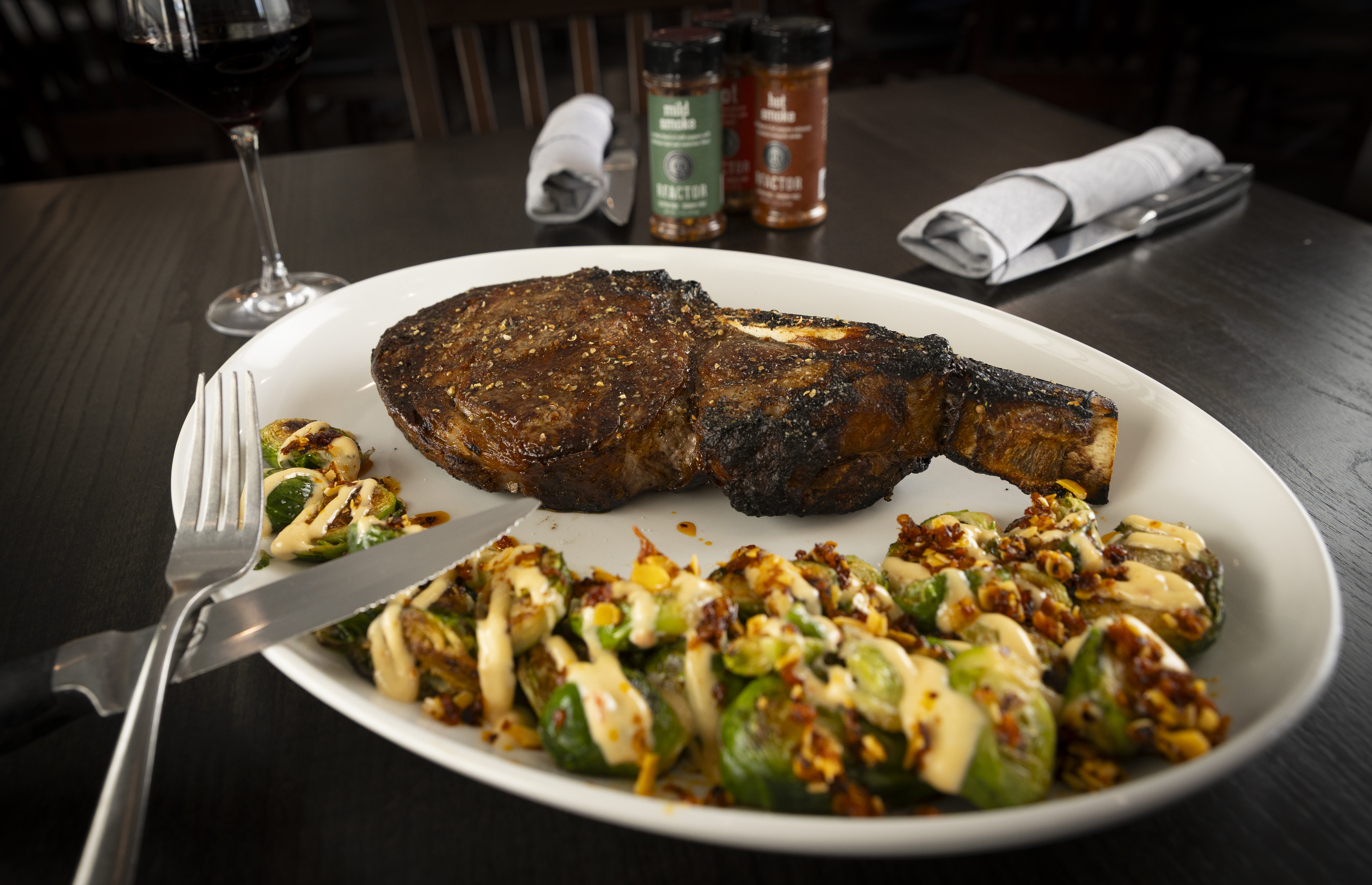 The bone-in Cowboy ribeye served with woodroasted Brussels sprouts. Ruhlman’s Steakhouse, located in Ashland along U.S. Highway 6, is drawing people from the quickly growing town as well as steak lovers from both Omaha and Lincoln.<br />(Ryan Soderlin / Flatwater Free Press)