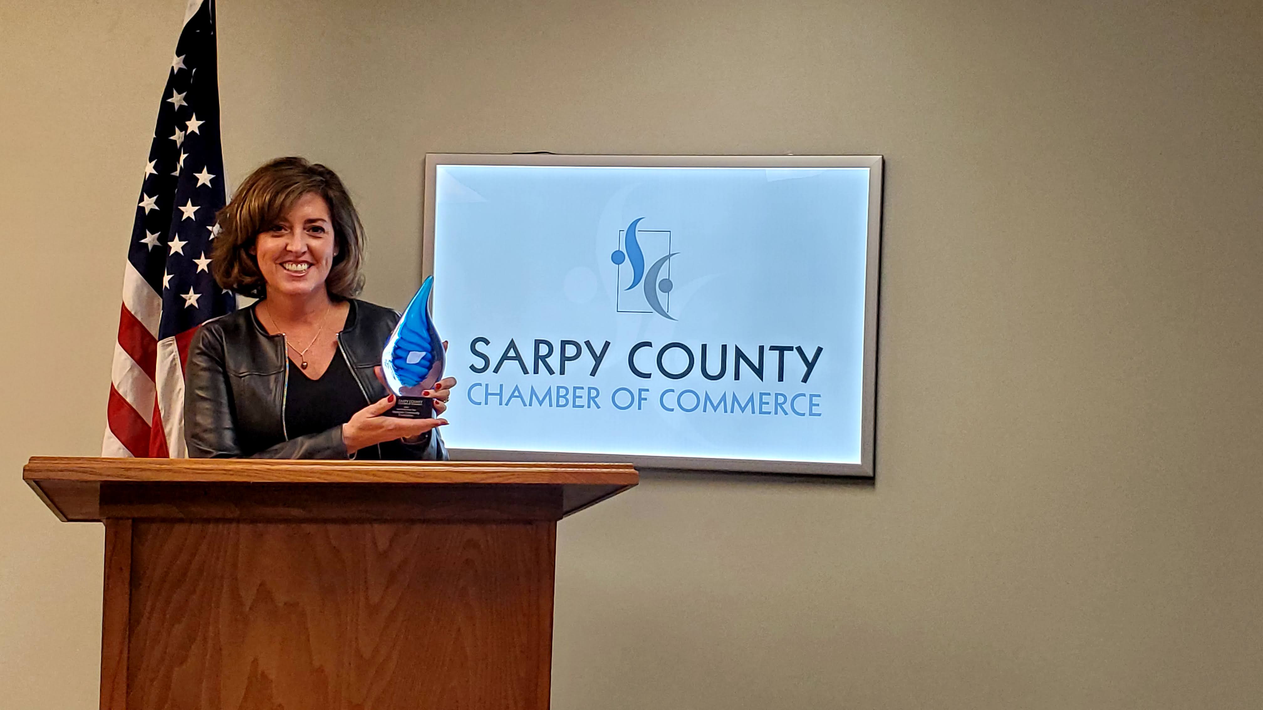 Tonee Gay, executive director of the Midlands Community Foundation, accepts the Nonprofit of the Year Award. (Sarpy County Chamber)