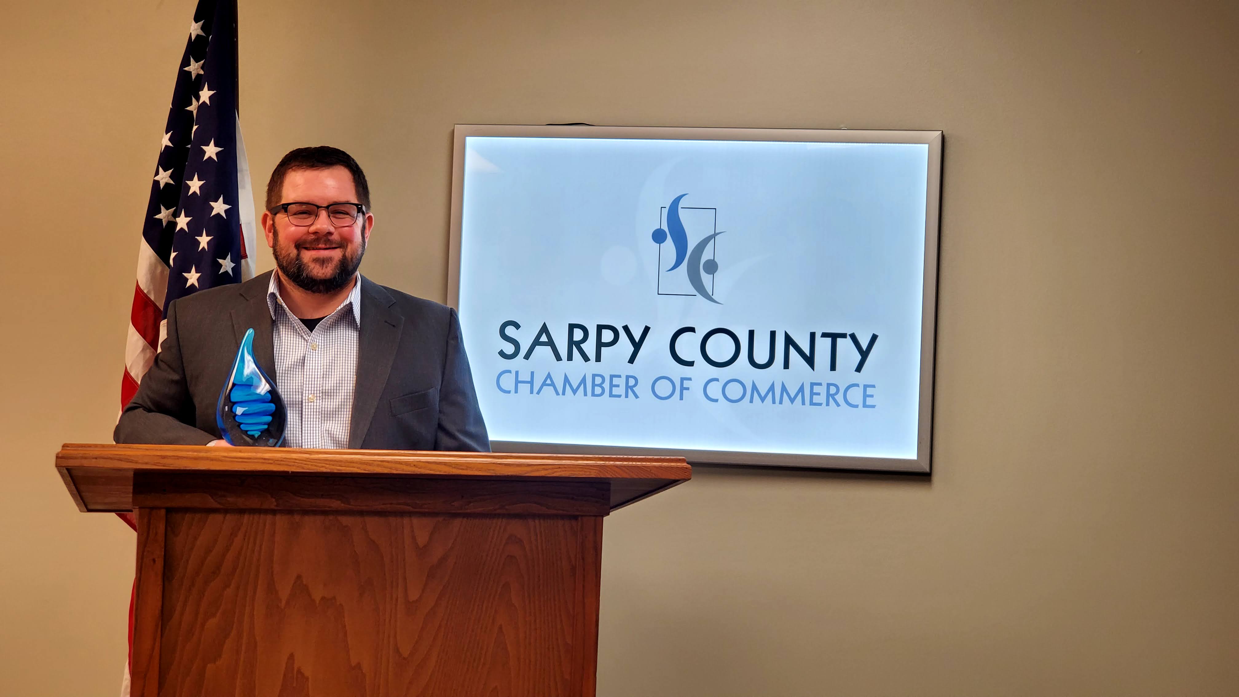 Ryan Ousey of ROC Business Technologies accepts the chamber’s New or Emerging Business of the Year Award. (Sarpy County Chamber)