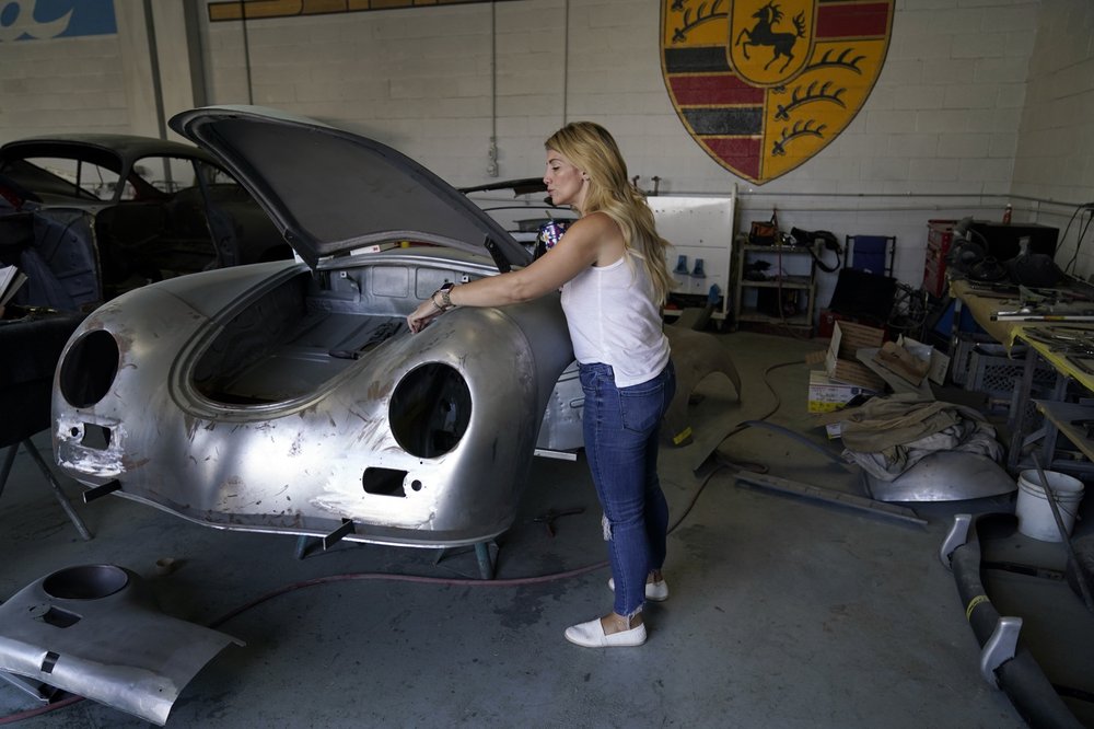 Laurina Esposito, co-owner of Espo Restoration, which specializes in restoring Porsches, inspects a frame at her Los Angeles shop Monday, Oct. 19, 2020. (AP)