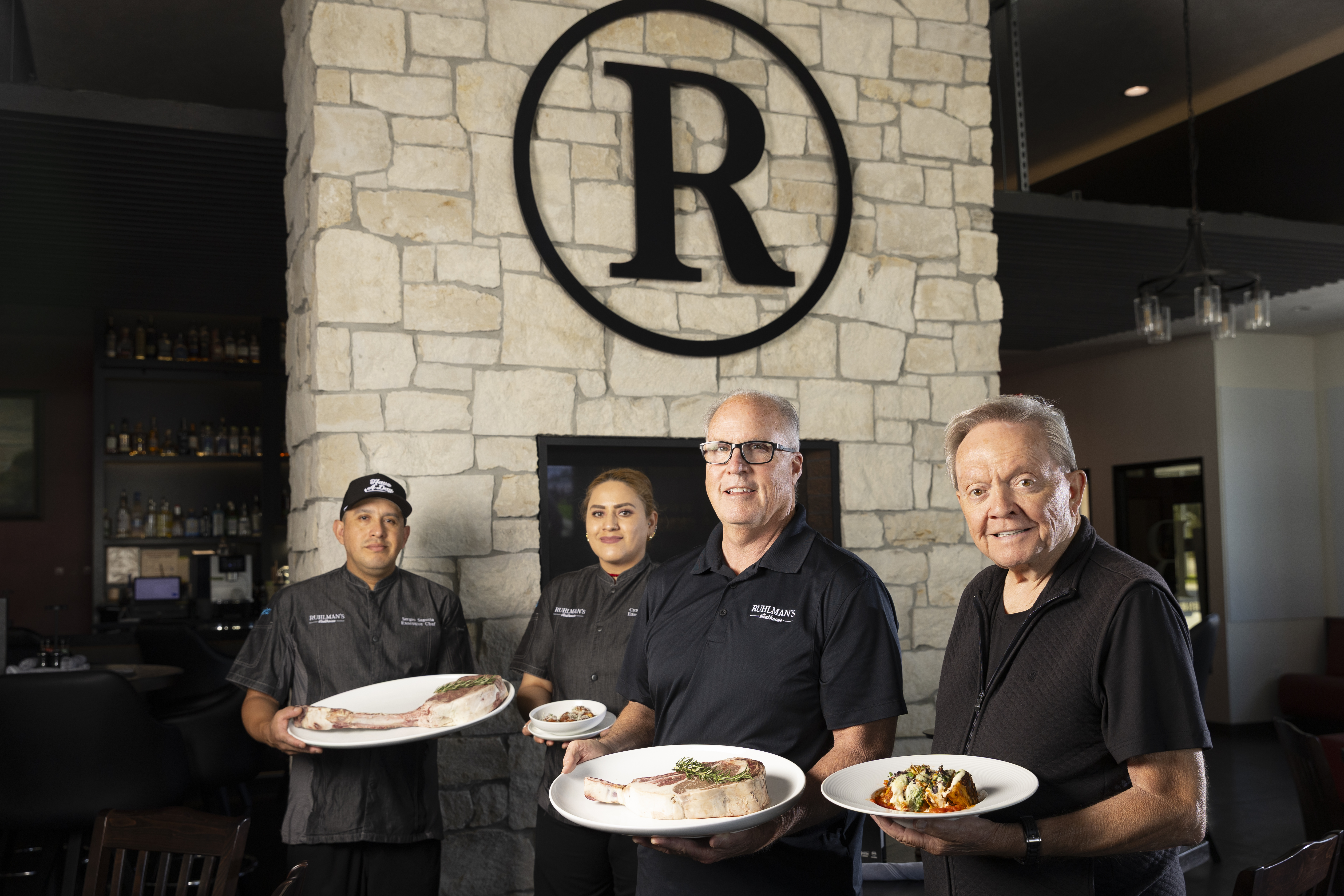 From left: Ruhlman’s Steakhouse Executive Chefs Sergio Sigovia and Cynthia Lopez, Ruhlman’s Steakhouse owner Phil Ruhlman and Willy Theisen, Ruhlman’s Steakhouse chief adviser. Rhulman, a longtime Gallup executive, hired Theisen, a Nebraska restaurant legend, to help him as he started the Ashland steakhouse.<br />(Ryan Soderlin / Flatwater Free Press)