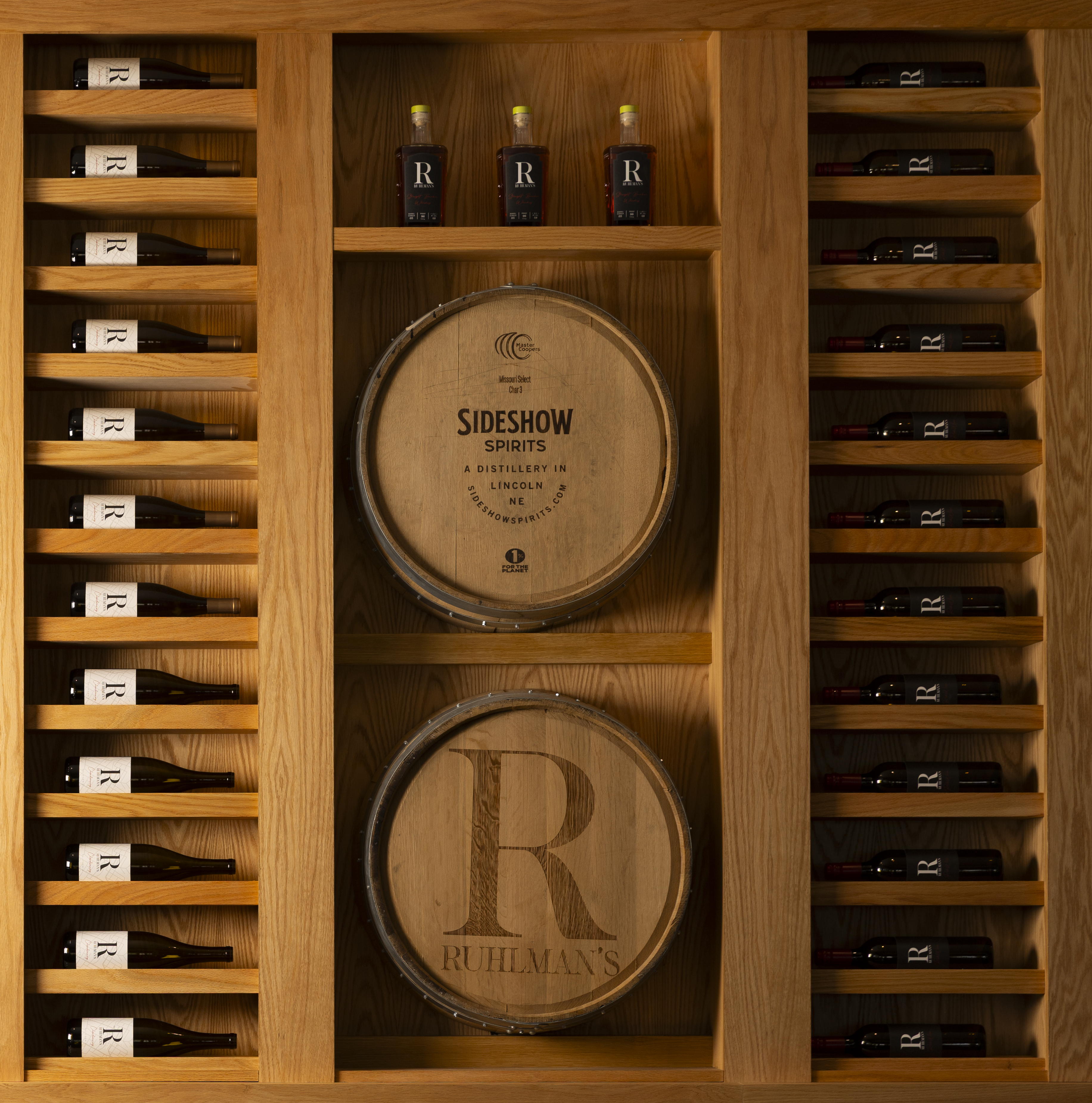 Bottles of wines and spirits decorate a wall at Ruhlman’s Steakhouse.<br />(Ryan Soderlin / Flatwater Free Press)