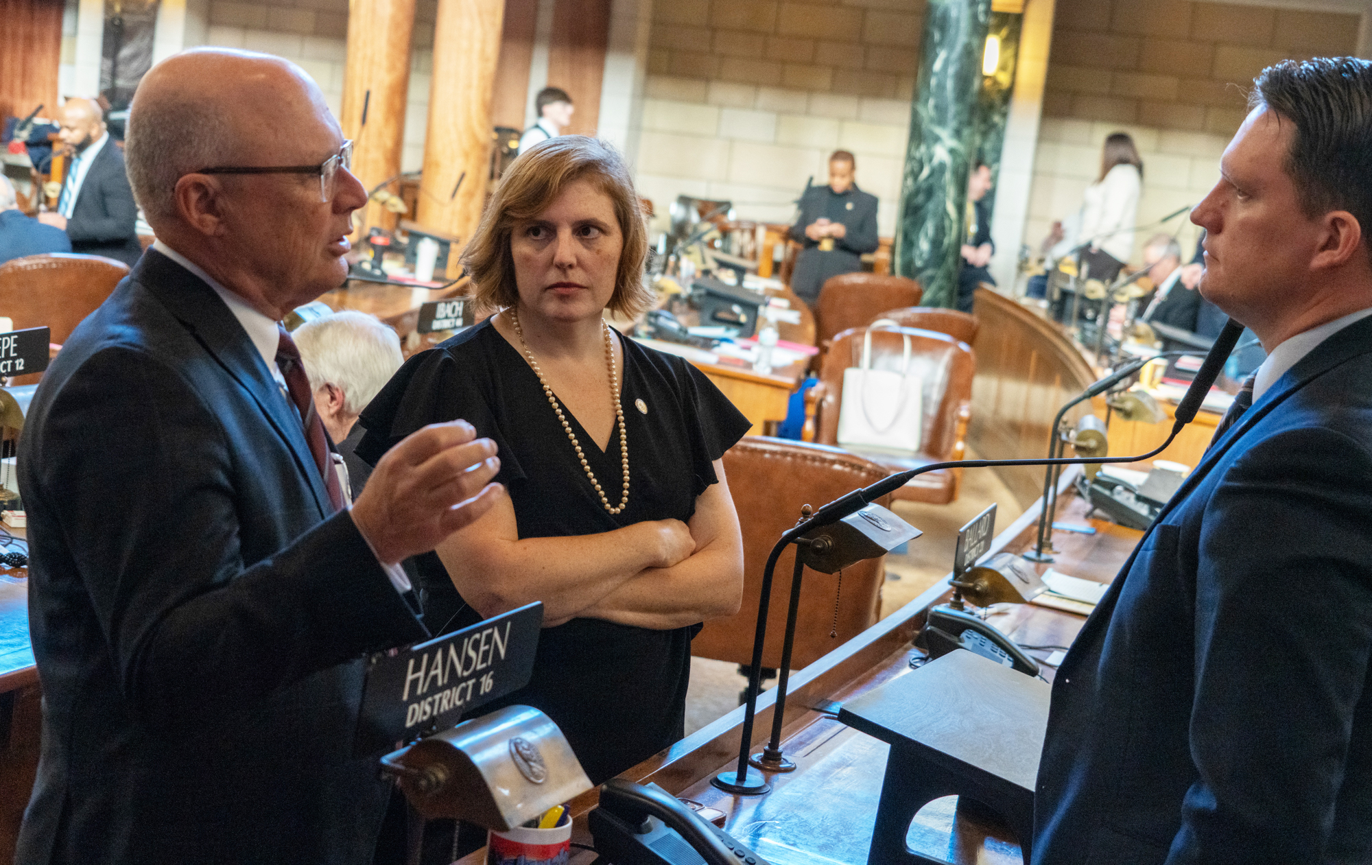 Speaker John Arch of La Vista and State Sen. Machaela Cavanaugh of Omaha meet on the floor of the Nebraska Legislature on Jan. 15, 2025.<br />(Zach Wendling / Nebraska Examiner)