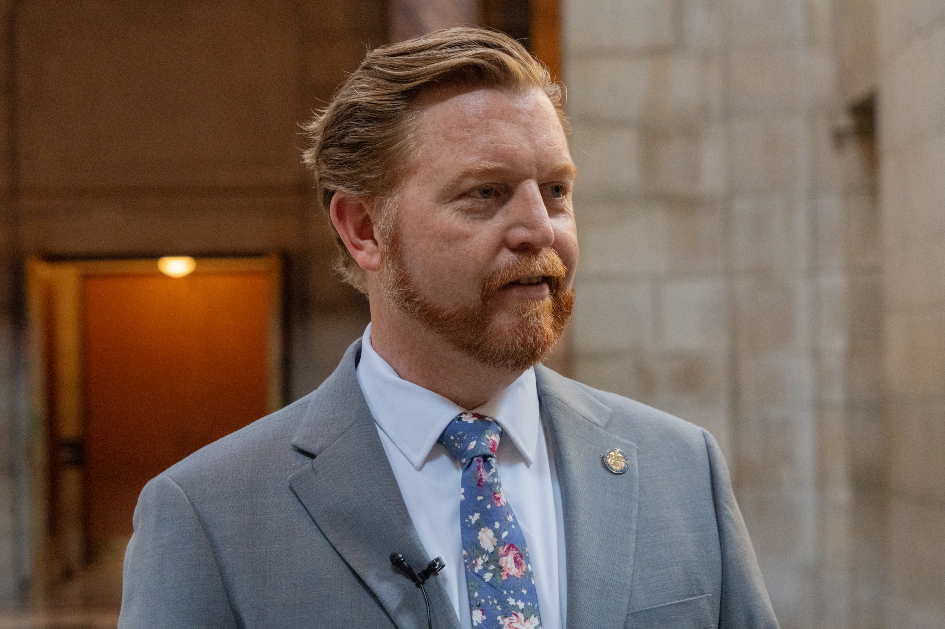 State Sen. John Cavanaugh of Omaha speaks with reporters after the core legislative proposal seeking to help implement medical cannabis stalls in committee,  April 17, 2025.<br />(Zach Wendling / Nebraska Examiner)
