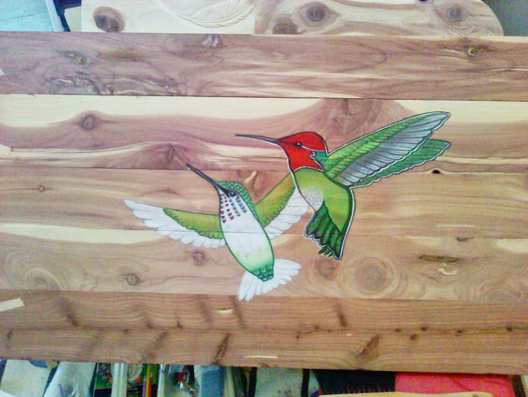 Anna Kramer lost many of her artistic works in the Marshall Fire, including this colored-pencil-on-wood drawing of two hummingbirds. This photo, along with Kramer’s story, will be archived by the Louisville Historical Museum.<br />(Courtesy of Anna Kramer)