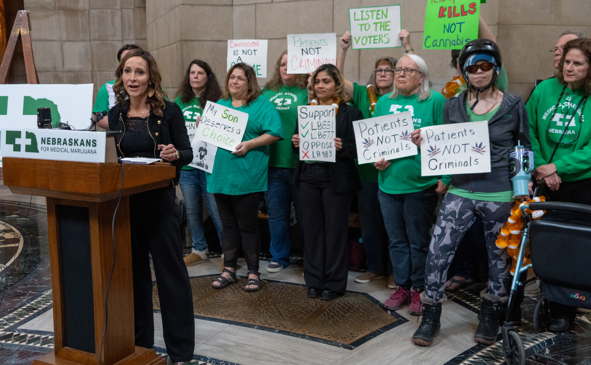 Crista Eggers of Nebraskans for Medical Marijuana (front)leads a news conference urging legislative support for bills to help implement a safe, fully regulated medical cannabis system on March 3, 2025.<br />(Zach Wendling / Nebraska Examiner)