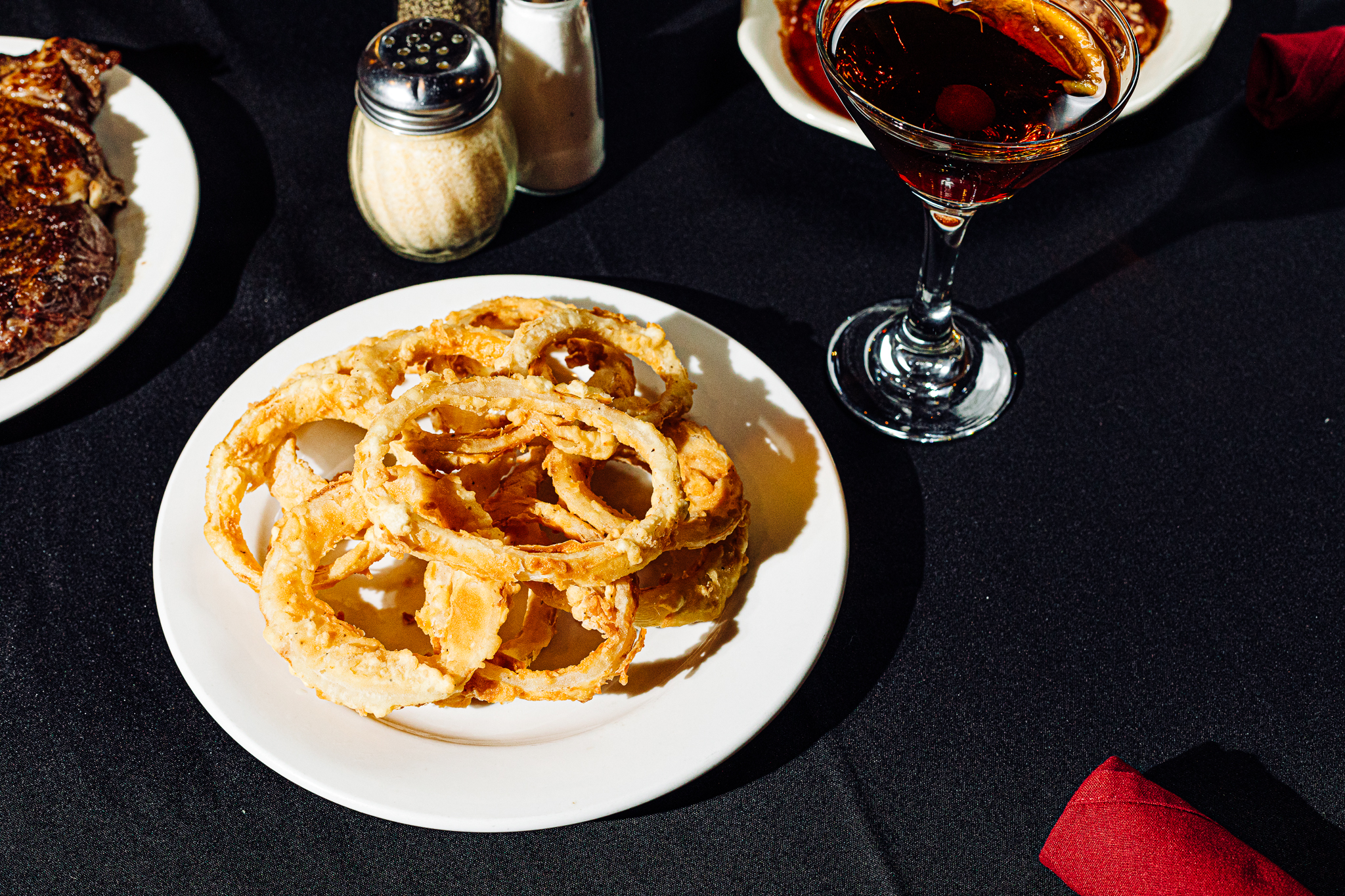 Thin rings of onion get breaded with a crispy, flaky crust at Cascio’s.<br />(Joshua Foo / Flatwater Free Press)