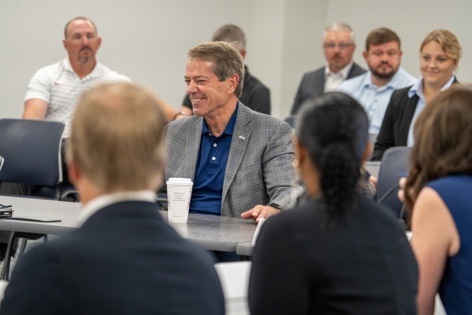 Nebraska Gov. Jim Pillen (center) addresses the new School Financing Review Commission during its first meeting on Aug. 12, 2025.<br />(Zach Wendling / Nebraska Examiner)