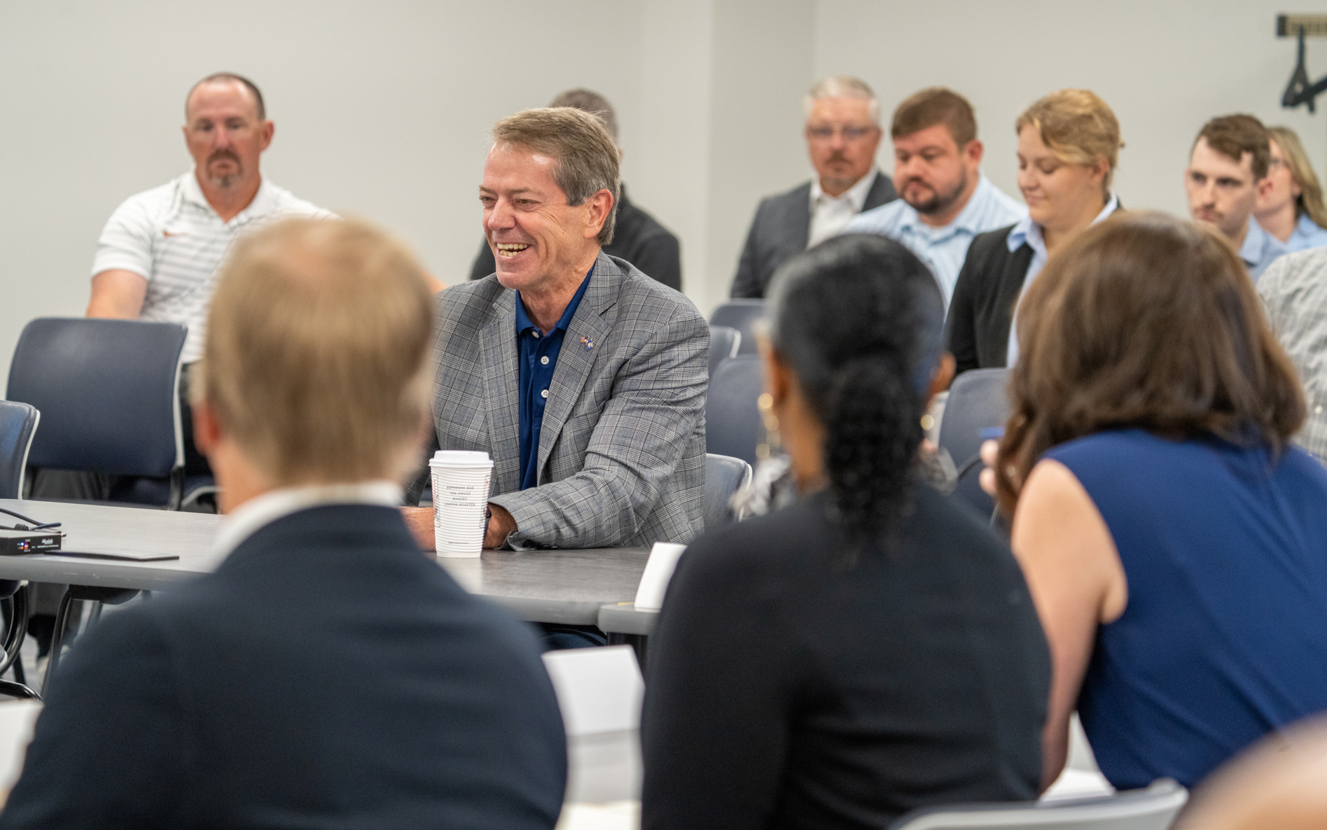 Nebraska Gov. Jim Pillen (center) addresses the new School Financing Review Commission during its first meeting.<br />(Zach Wendling / Nebraska Examiner)