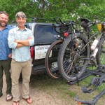 A pickup carrying water, food, other supplies and at least one support person drives with Andy Caven (left) and Mike Forsberg, pictured at Rowe Sanctuary, on their 2,500-mile bike ride from south Texas to northern Saskatchewan. Their bicycles are designed for gravel roads and "bikepacking." 
(Photo courtesy of Lori Potter)
