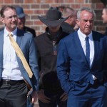 Health and Human Services Secretary Robert F. Kennedy Jr. (right) stands with Dr. Ben Edwards (left) outside the Reinlander Mennonite Church in Seminole, Texas, on Sunday, April 6, 2025, after a second measles death. 
(Annie Rice / AP Photo)