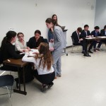Students from Atlanta's Midtown High School (foreground) confer during a quarterfinal round at the National High School Ethics Bowl in Chapel Hill, N.C., on Sunday, April 13, 2025.
 (Allen G. Breed / AP Photo)
