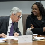 Federal Reserve Chairman Jerome Powell (left)talks with Board of Governors member Lisa Cook (right) during an open meeting of the Board of Governors at the Federal Reserve, June 25, 2025, in Washington. 
(Mark Schiefelbein / AP Photo)