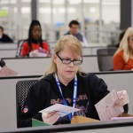 A worker examines ballots at the L.A. County Ballot Processing Center Nov. 4, 2025, in City of Industry, Calif.
(Ethan Swope / AP Photo)