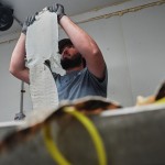 Jacob Sagrera inspects an alligator skin Tuesday, Jan. 20, 2026, at a farm in Abbeville, La. 
(Joshua A. Bickel / AP Photo)