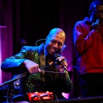 North Omaha Music & Arts Executive Director Dana Murray leads an all-star group of musicians during a lively song. A handful of Murray’s music students have forged successful careers in music after moving to larger cities such as New York.
(Joseph Saaid / Flatwater Free Press)