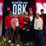 Dani Busboom Kelly and her family on stage at an official introductory event Feb. 6 in the Devaney Center. Busboom Kelly was a standout player for the Huskers in the 2000s before launching into her coaching career. 
(Courtesy of Nebraska Athletics)