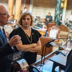 Speaker John Arch of La Vista and State Sen. Machaela Cavanaugh of Omaha meet on the floor of the Nebraska Legislature on Jan. 15, 2025. 
(Zach Wendling / Nebraska Examiner)