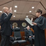 The Honorable Marcela A. Keim administers Philip Keenan Kleine's Oath of Office in a room full of smiling well-wishers Friday, May 2, 2025.
(Austin Petak / The Daily Record)