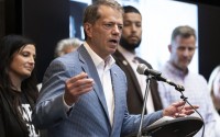 Gov. Jim Pillen speaks during a ceremonial bill signing for LB 1091 on Sept. 9 at Quality Living, Inc., in Omaha. 
(Lily Smith / Flatwater Free Press)