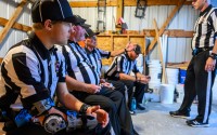 From left: referees Sam Roberts, Mike Hagge, Matt Hagge, Joshua Adams and J.D. Koerner talk during halftime of a football game on Aug. 28 in Laurel. At the age of 20, Roberts is believed to be the youngest full-time varsity high school football official in Nebraska. 
(Darin Epperly / Flatwater Free Press)