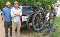 A pickup carrying water, food, other supplies and at least one support person drives with Andy Caven (left) and Mike Forsberg, pictured at Rowe Sanctuary, on their 2,500-mile bike ride from south Texas to northern Saskatchewan. Their bicycles are designed for gravel roads and "bikepacking." 
(Photo courtesy of Lori Potter)

